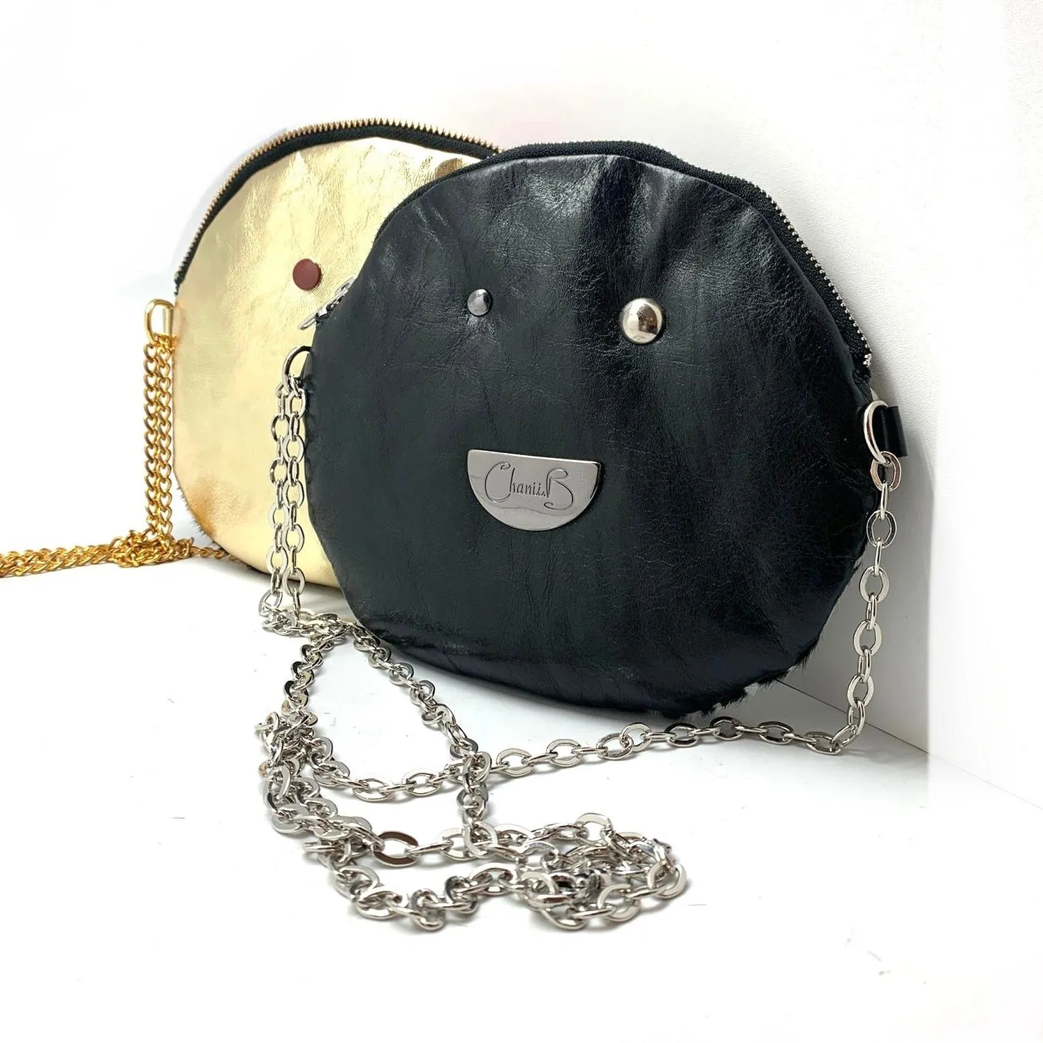 Muse wonky eye chain black-white cow handbag